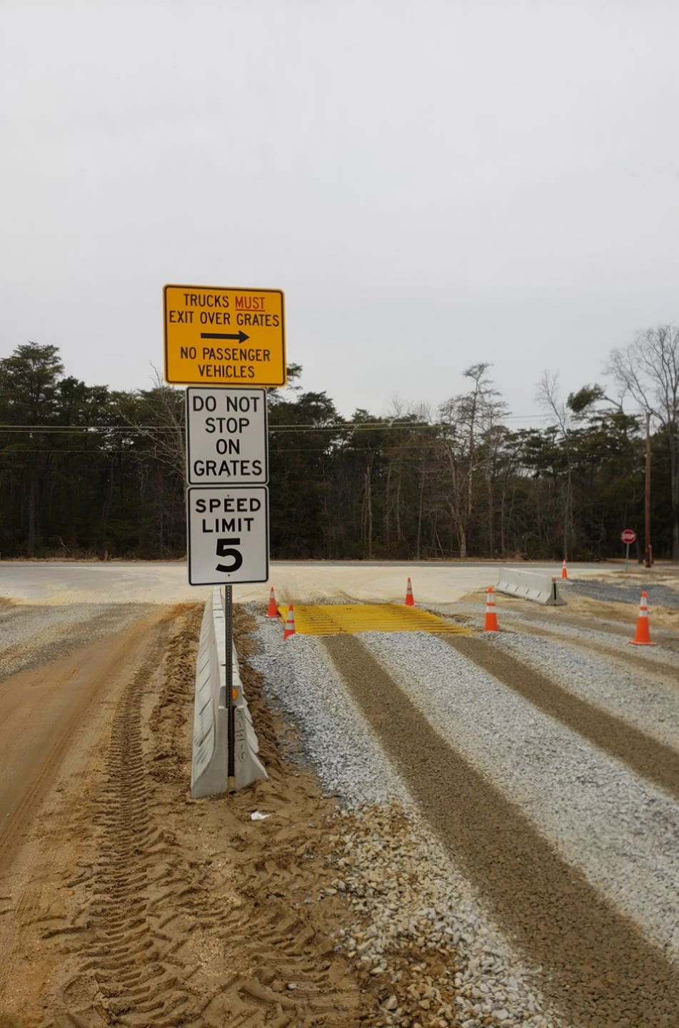 Construction worker reviewing site conditions